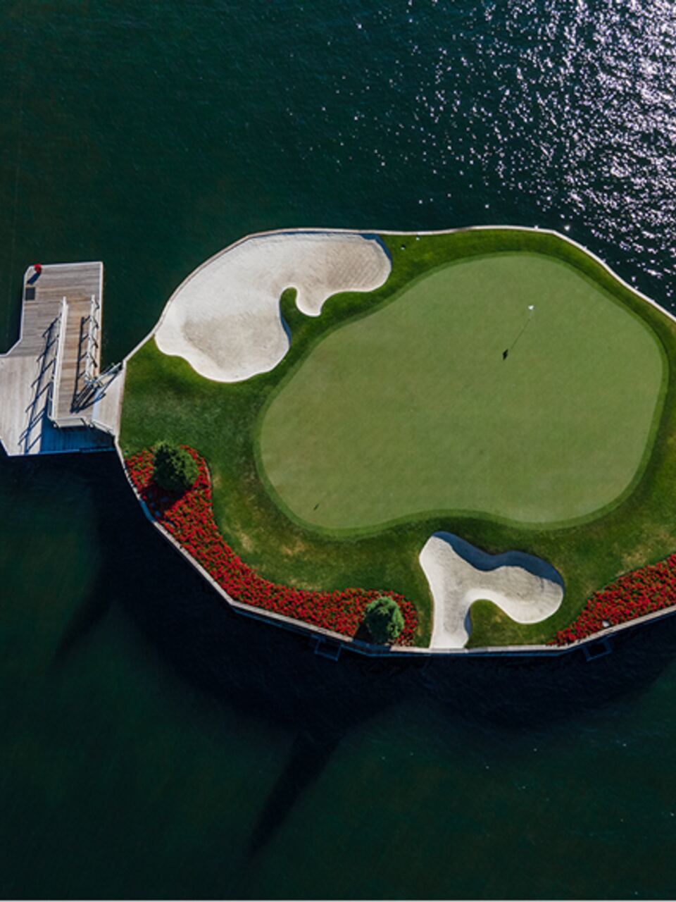 Aerial view of the floating island green surrounded by lake water at The Coeur d'Alene Resort in Coeur d'Alene, Idaho